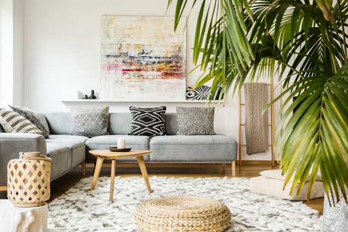 A living room with a large plant